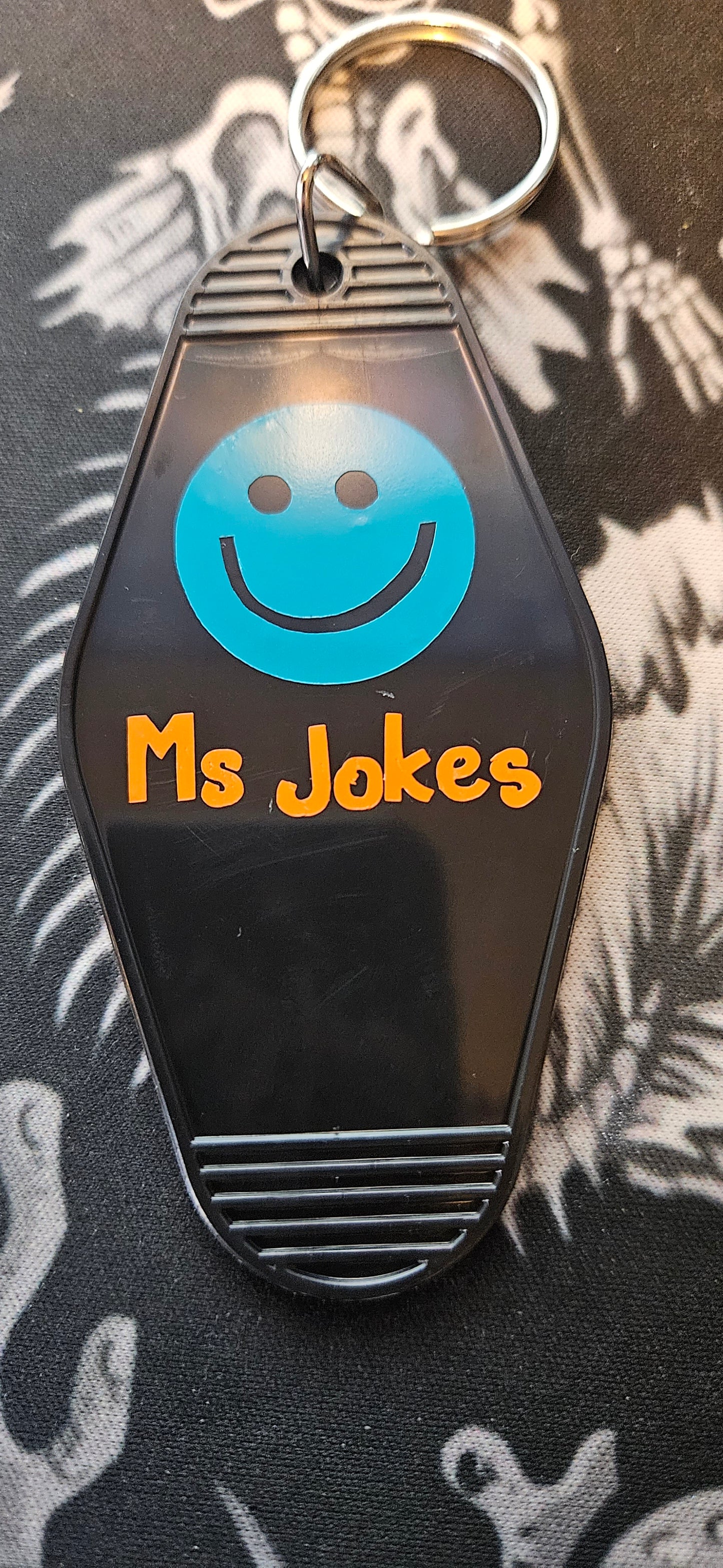 Ms. Jokes Motel Keychain